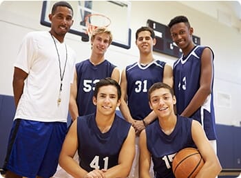 school basketball team with their coach